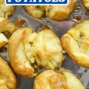 a baking tray of potatoes with text overlay "smashed potatoes".