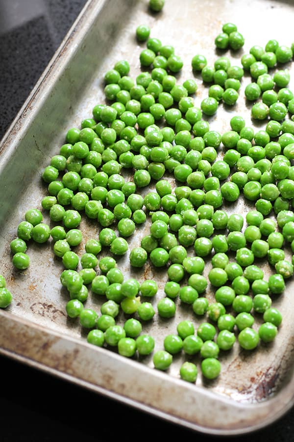 green peas on a baking tray.