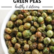 roasted peas in a white bowl with text overlay "air fryer crispy green peas".