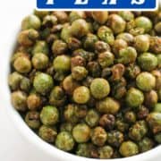 roasted peas in a white bowl with text overlay "air fryer peas".