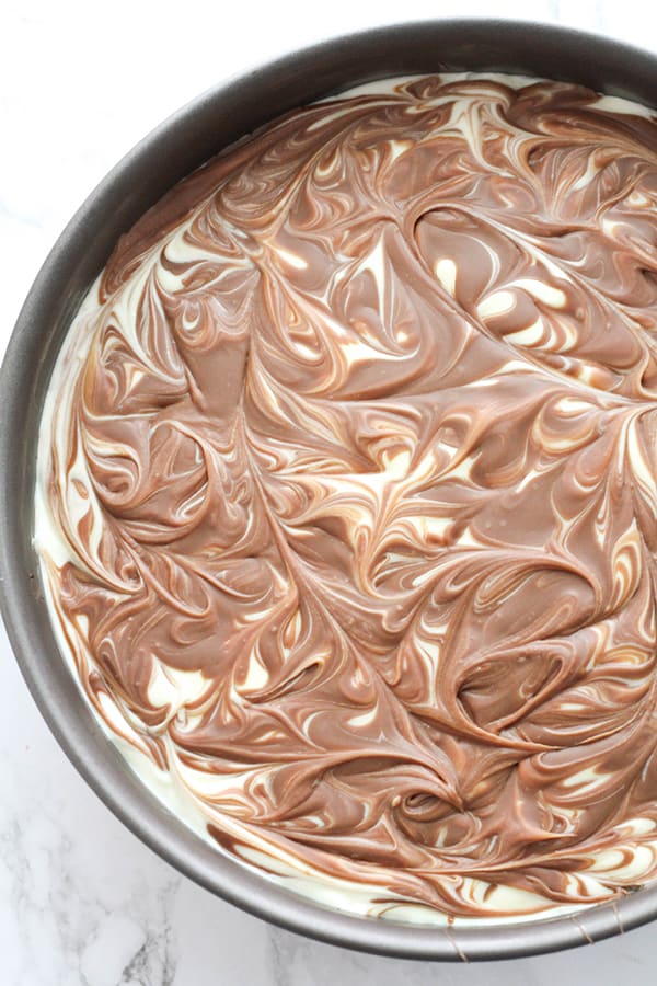 chocolate swirl on top of cheesecake.
