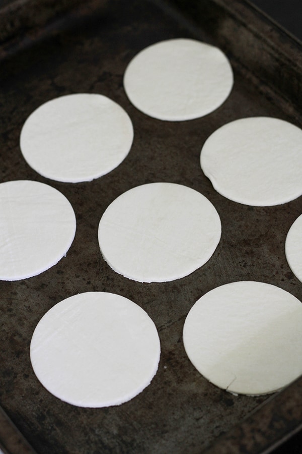 puff pastry circles on a baking tray.