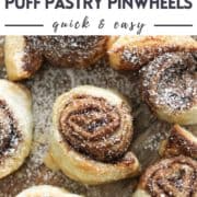 pinwheels on a wooden board with text overlay "nutella puff pastry pinwheels"