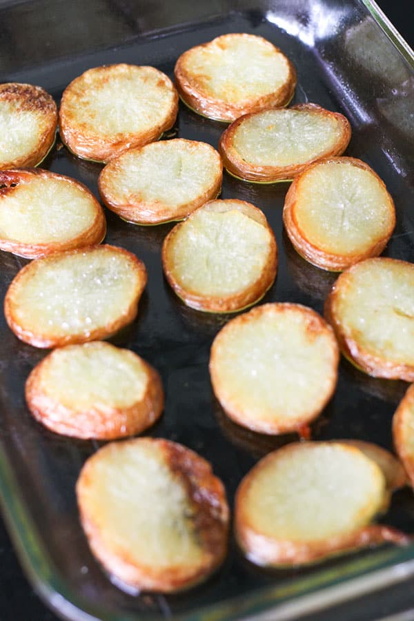salt and vinegar potatoes in a baking dish.