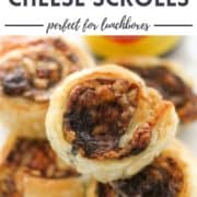puff pastry pinwheels stacked on top of each other with text overlay "vegemite & cheese scrolls".
