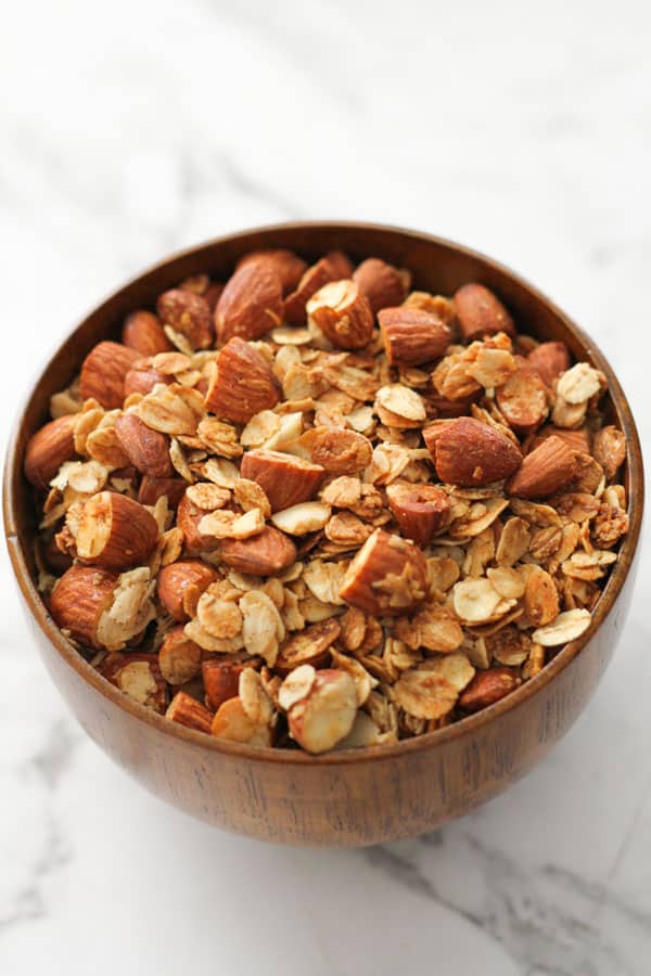 air fryer granola in a wooden bowl.