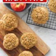 muffins on a wooden board and a wire rack with text overlay "apple cinnamon muffins".