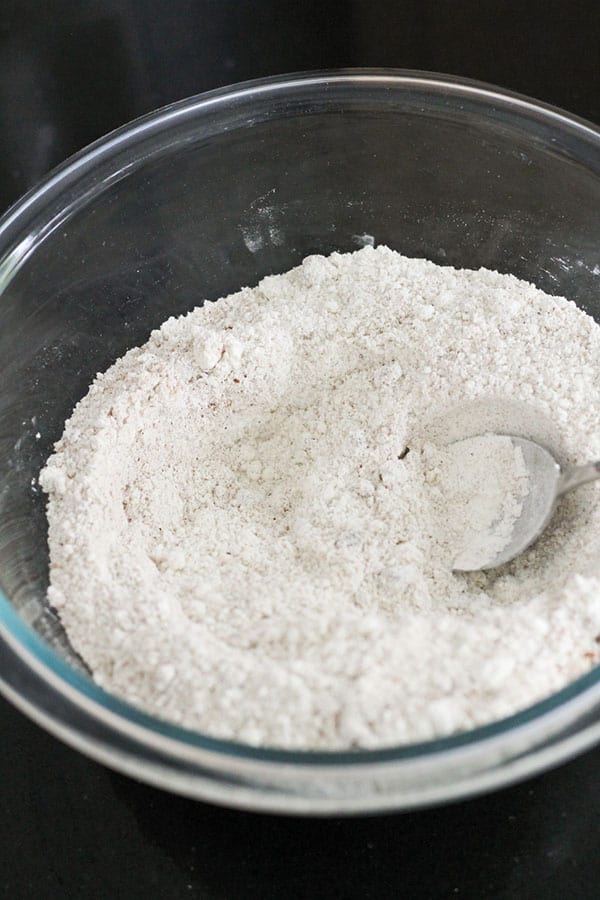 flour and sugar mixed in a glass bowl.