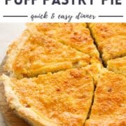 pie sliced on a wooden board with text overlay "bacon & egg puff pastry pie".