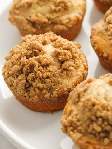 cinnamon muffins on a white plate.