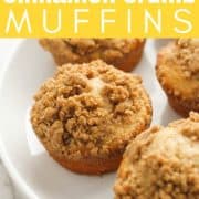 muffins on a white plate with text overlay "cinnamon crumb muffins".