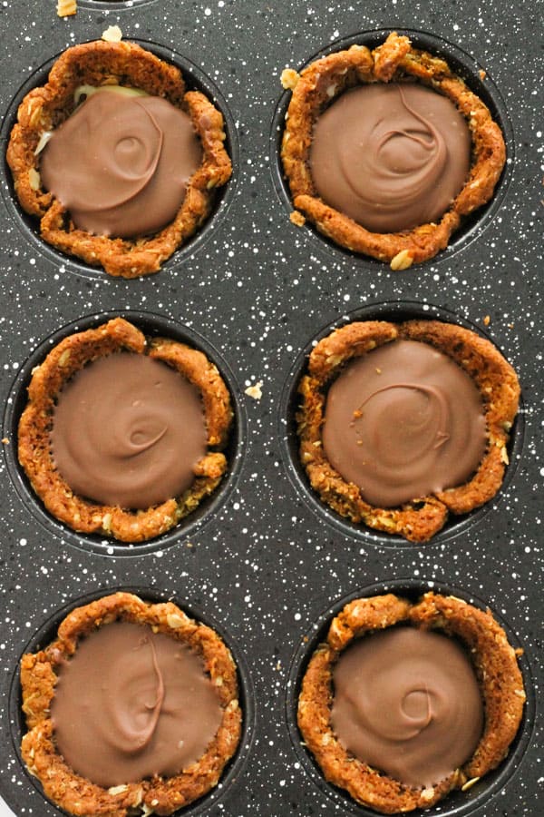 mini caramel tarts in a muffin tin.