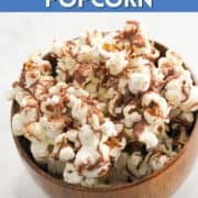 popcorn covered in chocolate in a bowl with text overlay "chocolate popcorn".