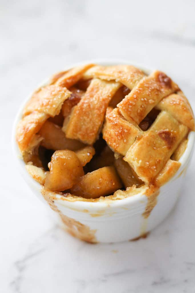 mini apple pie in a white ramekin. 