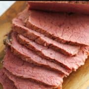 corned beef slices with text overlay "how to cook corned beef".