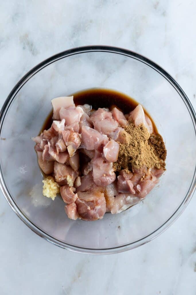 raw chicken pieces in a bowl.
