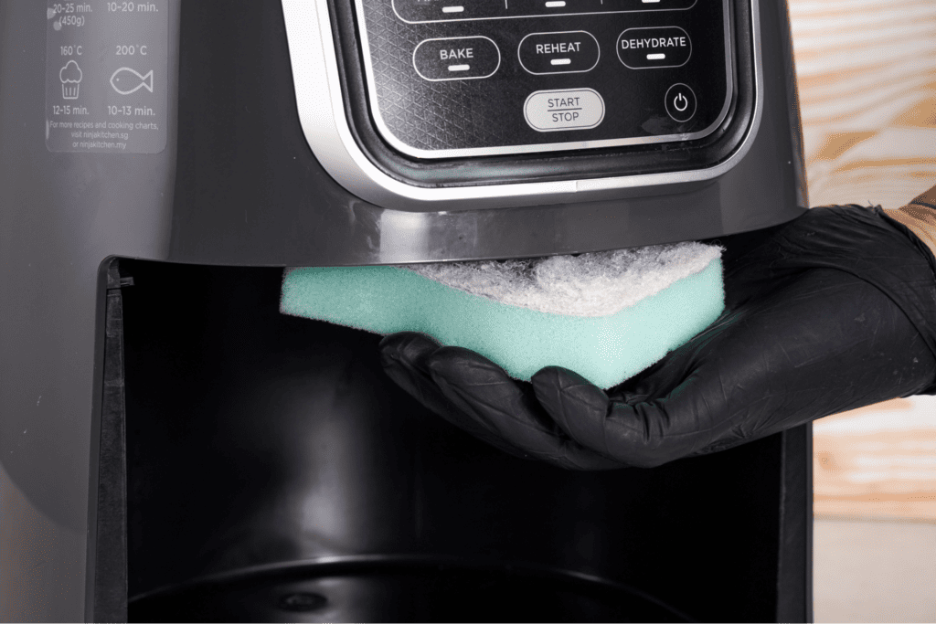 Cleaning the air fryer heating system with sponge